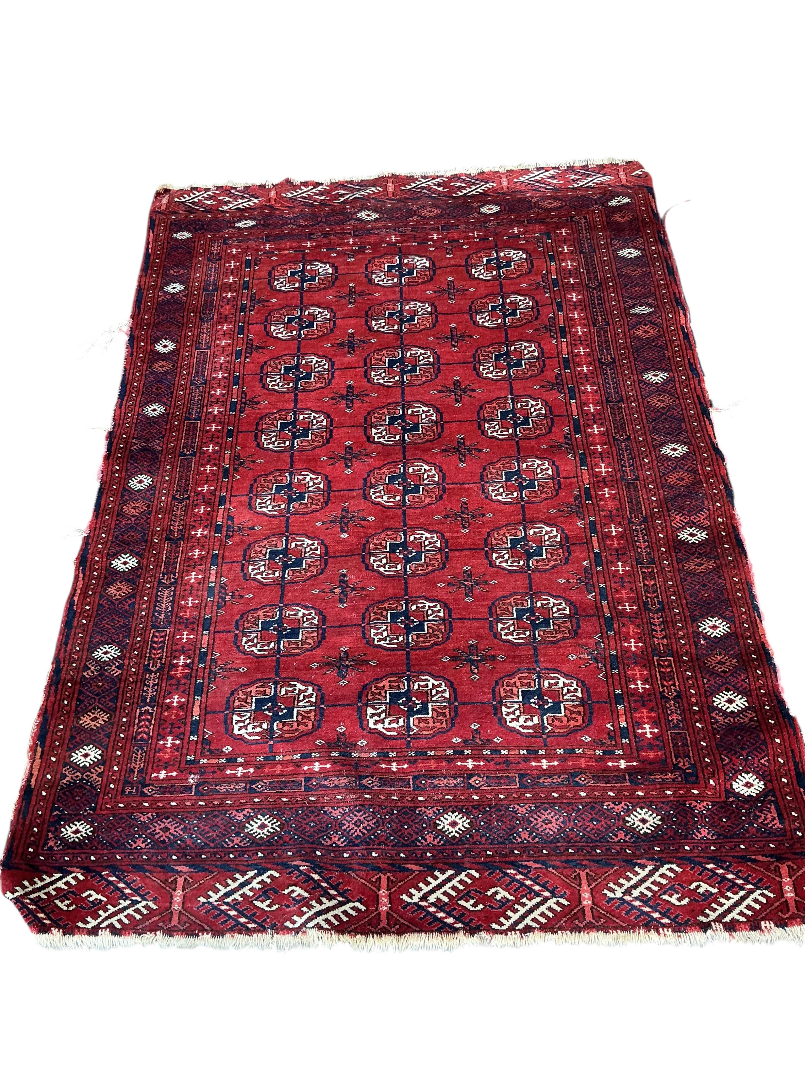 A Bokhara red ground rug, 155 x 108cm